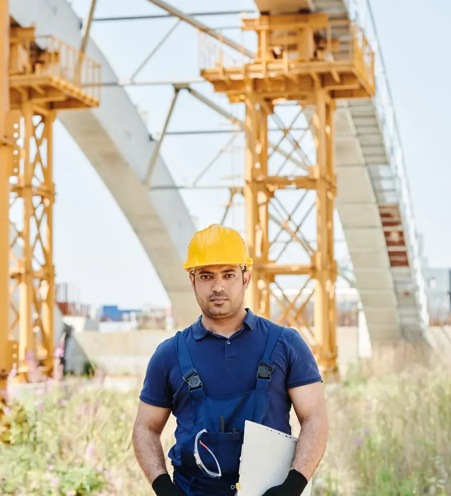 Safety professional wearing a hard hat on an industrial worksite